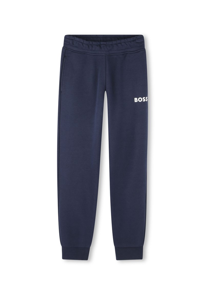 Pantalon de survêtement marine en tissu doux, avec une taille élastique, deux poches latérales et un logo "BOSS" blanc sur la cuisse gauche.