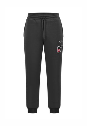Sorte sweatpants lavet af en bomuldsblanding, med elastisk talje og snoretræk, mansjetter ved anklerne og et kontrastmærke.