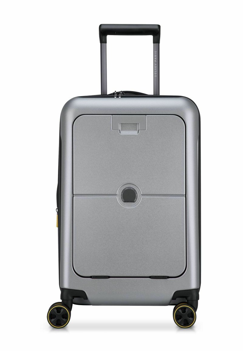 Valigia rigida argentata di forma rettangolare, con manico retrattile, due ruote con dettagli gialli e un sistema di chiusura centrale.