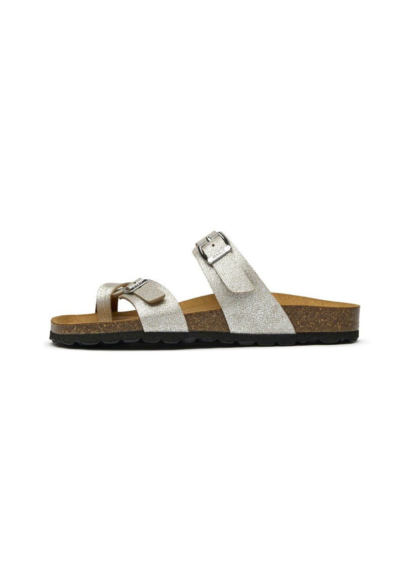 Silver glitter slide sandal with two adjustable straps, cork footbed, and a black textured rubber sole. Minimalistic design, casual style.