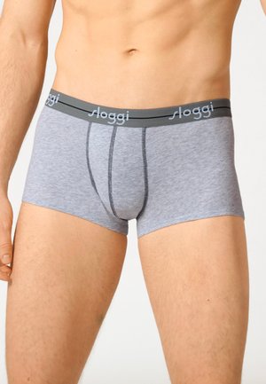 Boxer in cotone grigiocon un elastico nero in vita che presenta il marchio "sloggi". Il tessuto ha una texture liscia e un design aderente.