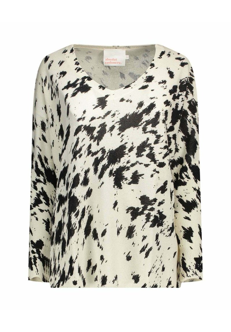 Maglione a maglia con motivo in bianco e nero, scollo a V, maniche lunghe e vestibilità rilassata. Il tessuto appare morbido con diverse trame sparse.