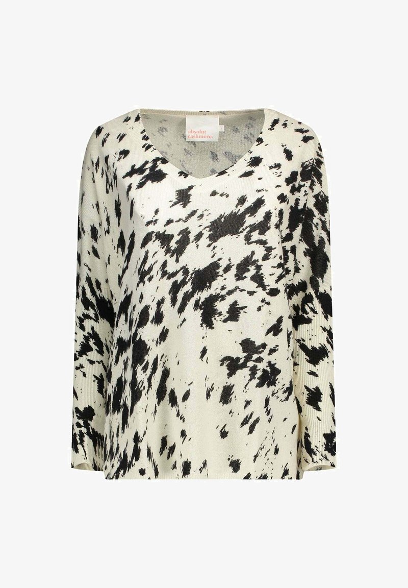 Maglione a maglia con motivo in bianco e nero, scollo a V, maniche lunghe e vestibilità rilassata. Il tessuto appare morbido con diverse trame sparse.