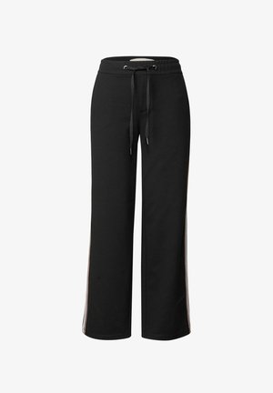 Svarta sweatpants med en lös passform, dragsko i midjan och sidosten i kontrasterande färger. Tillverkade av mjukt, texturerat tyg.