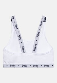 Biely bavlnený bralet s mäkkou textúrou. Obsahuje šedé ramienka a pás, obidva zdobené slovom "milý" a malými srdiečkovými vzormi.