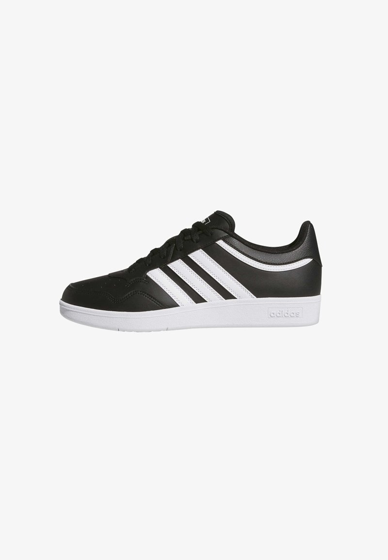 Black athletic shoes with a smooth synthetic upper, featuring three white stripes on the side and a white rubber sole.