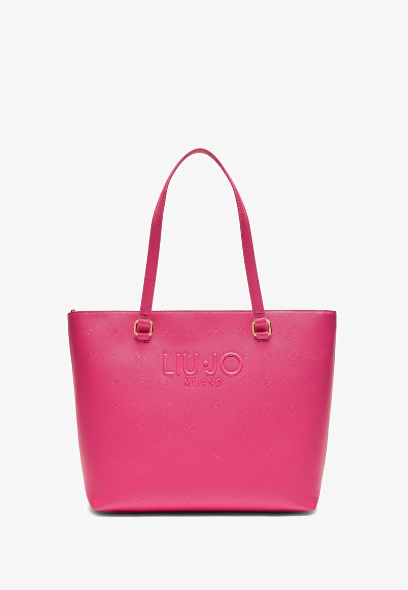 Sac fourre-tout synthétique rose avec deux bretelles, logo en relief, texture lisse et forme structurée. Garnitures en métal doré.