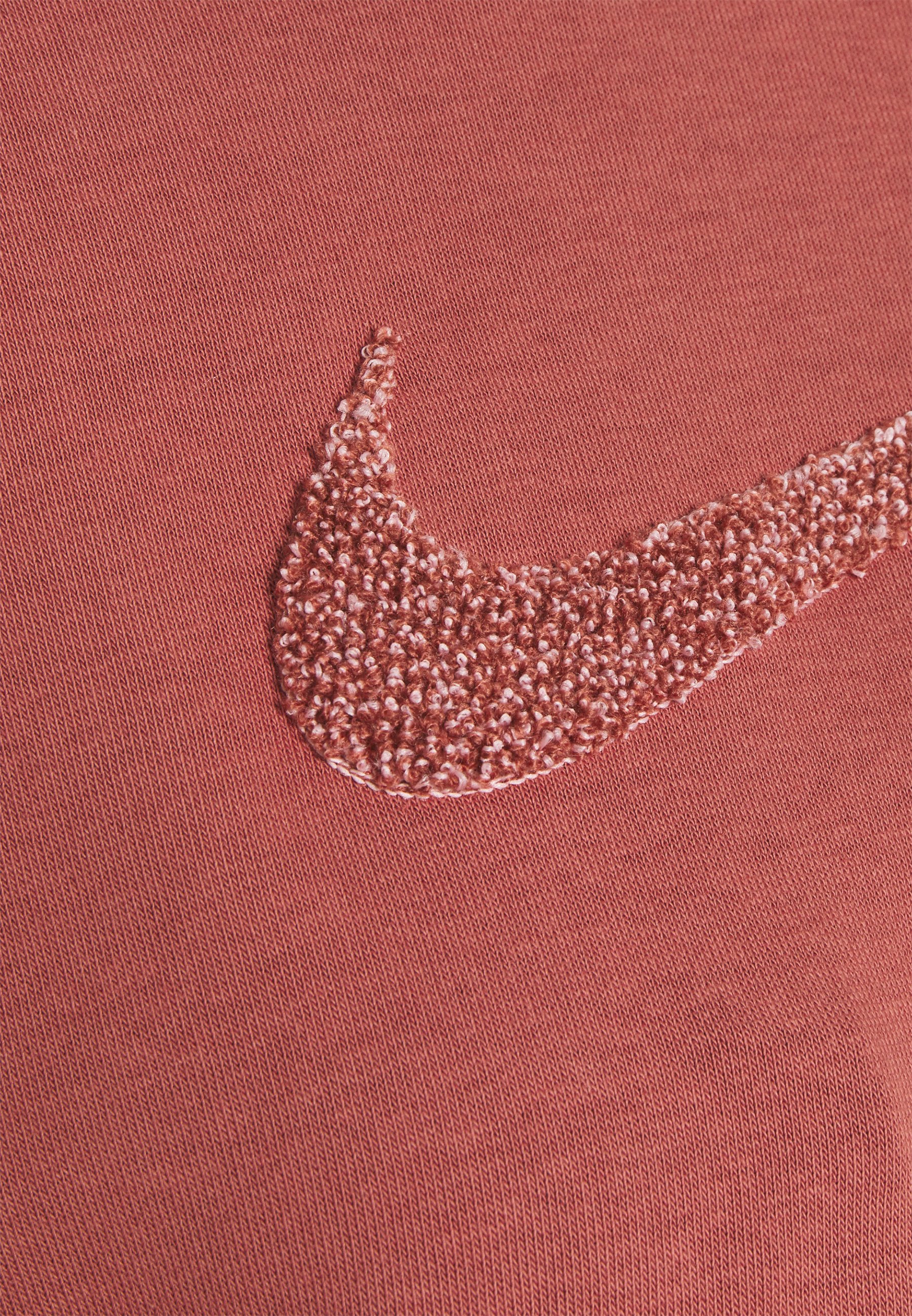 rust color nike sweatshirt