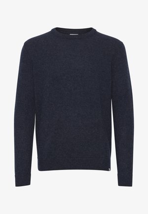 Tume sinine kampsun, mis on valmistatud pehmest ja tekstuuriga kangast. Omab ümarat kaelust, pikki varrukaid ning soonikkoes mansette ja allserva. Lihtne disain.