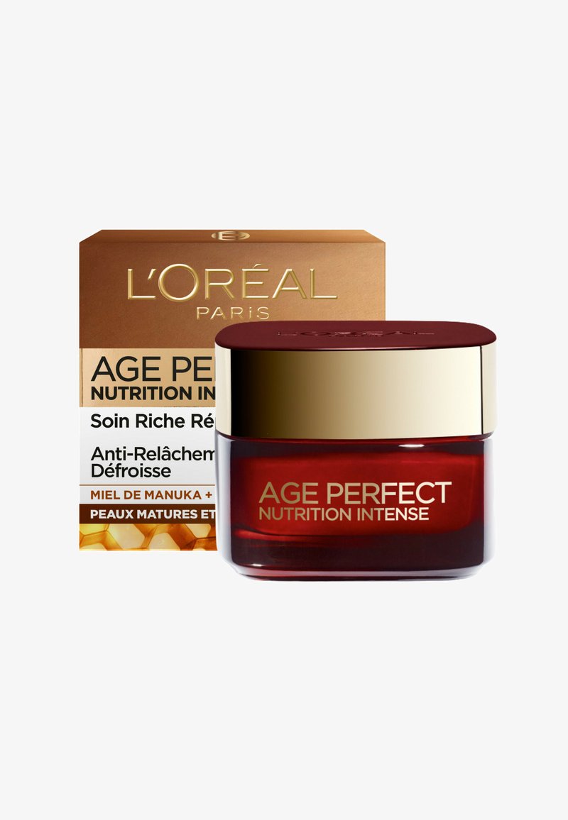 Crème Nutrition Intense Age Perfect de L'Oréal Paris dans un pot rond rouge profond avec un couvercle doré, accompagnée d'une boîte dorée et blanche avec les détails du produit.