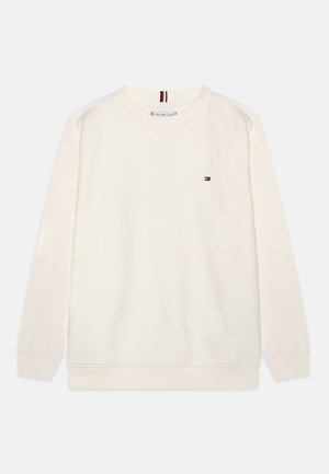 Sweatshirt couleur crème en tissu mélange de coton. Comprend un col rond, des poignets côtelés et un petit logo sur la poitrine.