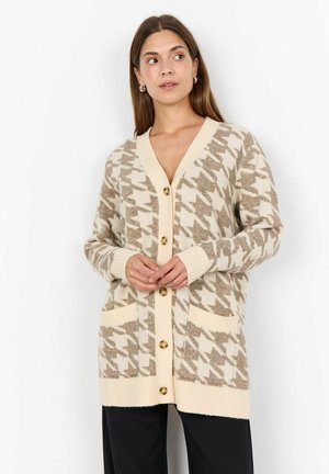 Knit cardigan with a houndstooth pattern in beige and cream. Features long sleeves, a v-neck, gold buttons, and two front pockets.