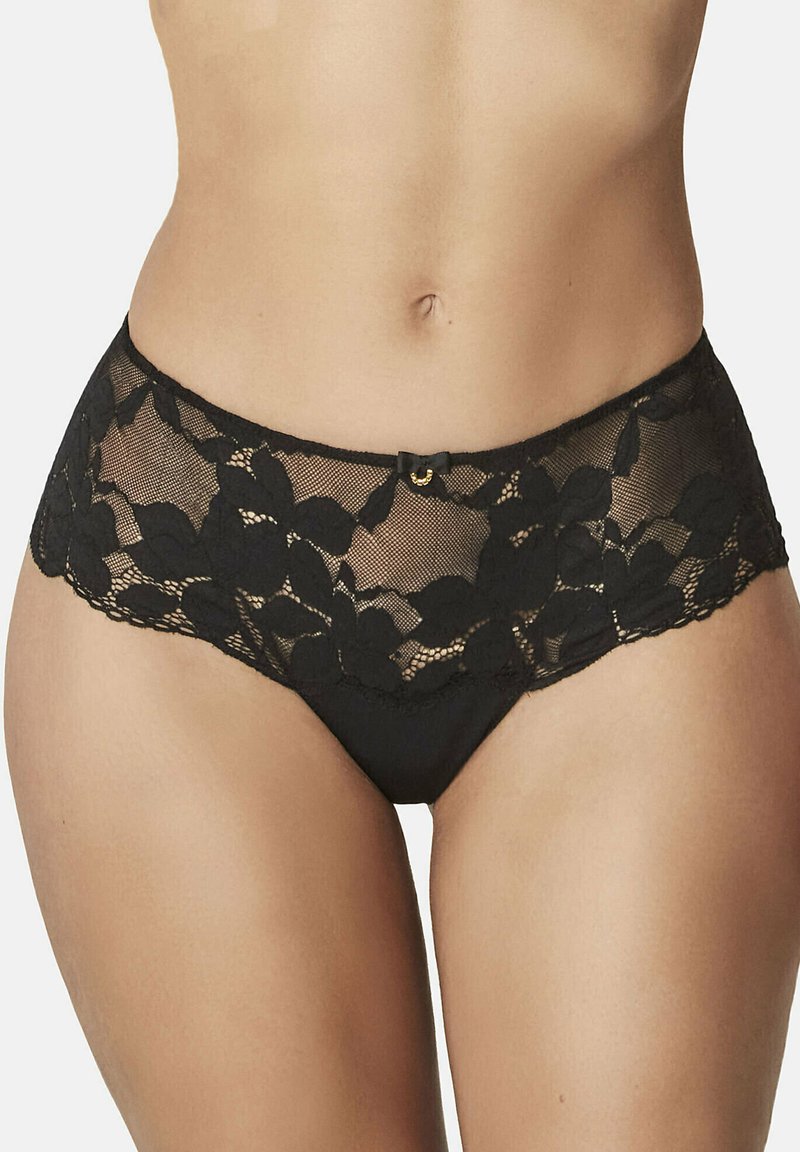 Culotte en dentelle noire avec un motif floral, des bords festonnés et un petit nœud décoratif sur la taille, d'une texture douce et translucide.