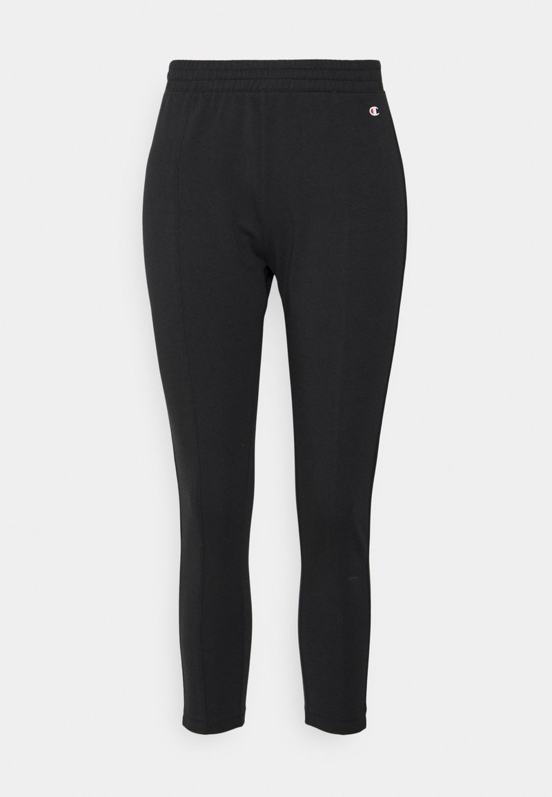 Schwarze Sportleggings mit einem elastischen Bund, dehnbarem Stoff, tailliertem Design und einem kleinen Logo-Detail an der Seite.