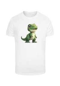 White T-shirt featuring a cartoon green dinosaur illustration with large eyes, a wide mouth, and short arms.