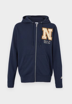 Sweat à capuche zippé bleu marine avec poches avant, grande écusson en forme de "N" et texte "There is No Finish Line" sur la poitrine, et petit logo Nike sur la manche.