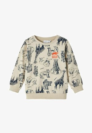 Beige sweatshirt featuring dark animal sketches, including elephants and lions, with an orange "Animal Planet" logo on the front.