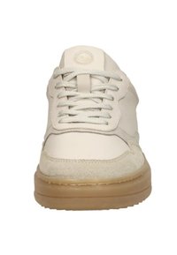 Beige low-top sneaker with textured toe cap, white laces, padded tongue, and translucent gum rubber sole.