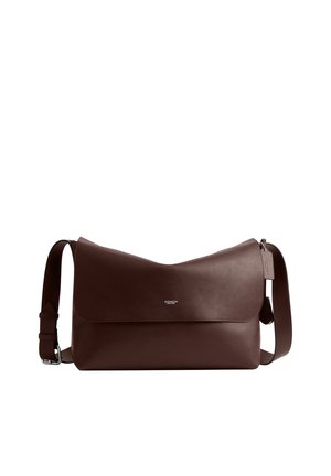 Dark brown leather messenger bag with adjustable strap and flap closure, small silver Coach logo centered on front flap.