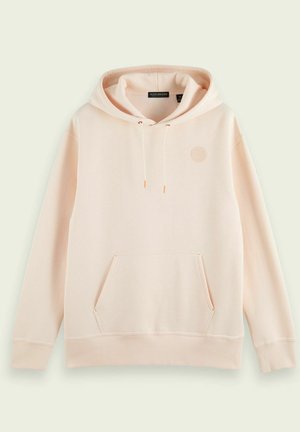 Sweat à capuche beige clair avec poche avant, cordons, poignets côtelés et logo circulaire texturé subtil sur la poitrine.