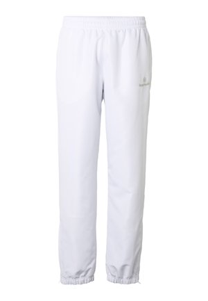 Bílé kalhoty s pružným pasem, manžetami u kotníků, rovného střihu a jemným logem na horní části stehna.