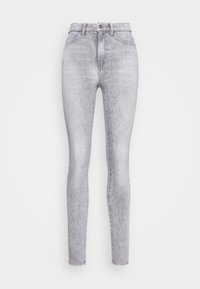 Jeans ajustados de talle alto en denim gris claro con un acabado desvanecido, que cuentan con un cierre frontal de botón y cremallera, y cinco bolsillos.