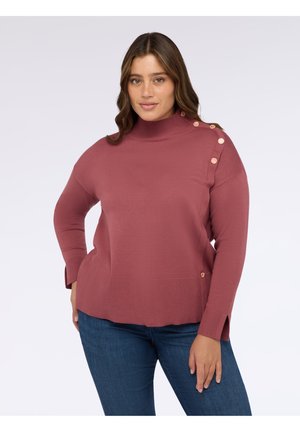 Maglione rosa in tessuto morbido, con collo alto, maniche lunghe e bottoni decorativi sulla spalla. Dettaglio a coste all'orlo.