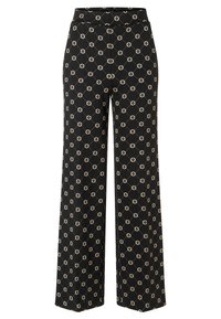 Black wide-leg pants with beige geometric diamond and dot pattern all over, featuring a high waistband and straight hem.