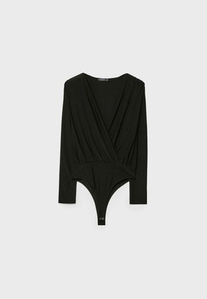 Body nero a maniche lunghe con scollatura a V, design avvolgente e chiusura a scatto sul fondo. Realizzato in tessuto morbido con una superficie liscia.