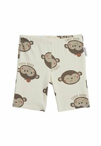 Shorts en coton avec un fond crème, ornés de visages de singes marron en motif répété, et d'un texte amusant indiquant "Good Vibes". Taille élastique.