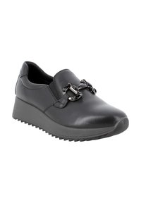 Scarpa nera in pelle senza lacci con suola a zeppa e suola in gomma. Presenta dettagli decorativi in catena nera sul davanti. Finitura liscia.