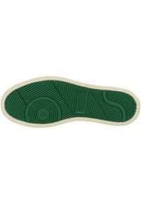 Semelle de chaussure en caoutchouc verte avec un motif texturé, comportant un design circulaire au centre et un bord crème. Marquée de la taille 42.