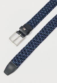 Braided fabric belt in alternating dark and light blue with navy leather tip and silver rectangular buckle engraved with brand name.