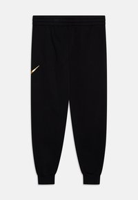 Juodi sportiniai šortai, pagaminti iš minkštos medžiagos, su elastinga juosmeniu ir auksiniu "Nike" logotipu kairėje pusėje. Su siaurėjančia kojos forma.