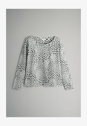 Top de manga larga hecho de una tela ligera con un patrón de leopardo en blanco y negro. Cuello redondo y diseño de ajuste relajado.