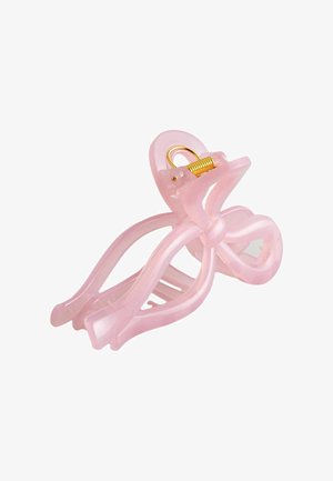 Rosa durchscheinende Kunststoff-Haarspange mit goldfarbenem Metallfeder-Scharnier auf weißem Hintergrund.