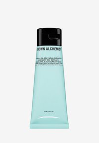 Tubetto blu acquamarina con tappo flip-top nero. Il testo include il nome del prodotto e gli ingredienti. Forma cilindrica elegante con finitura opaca.