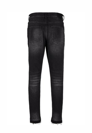 Fekete farmer nadrág slim fit szabással, koptatott szegéllyel és két hátsó zsebbel. Az anyag enyhén kopott textúrájú.
