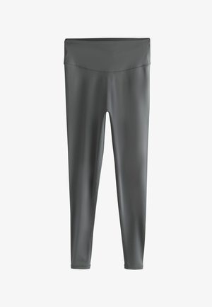 Sivé legíny vyrobené z elastického, hladkého materiálu s vysokým pásom, obsahujúce ploché švy a priliehavý strih.