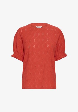 Raudona trumpa rankovėmis palaidinė su tekstūruota, aklų paviršiumi. Pasipuošusi pūstomis rankovėmis su raukiniais ir apvaliu kaklu.