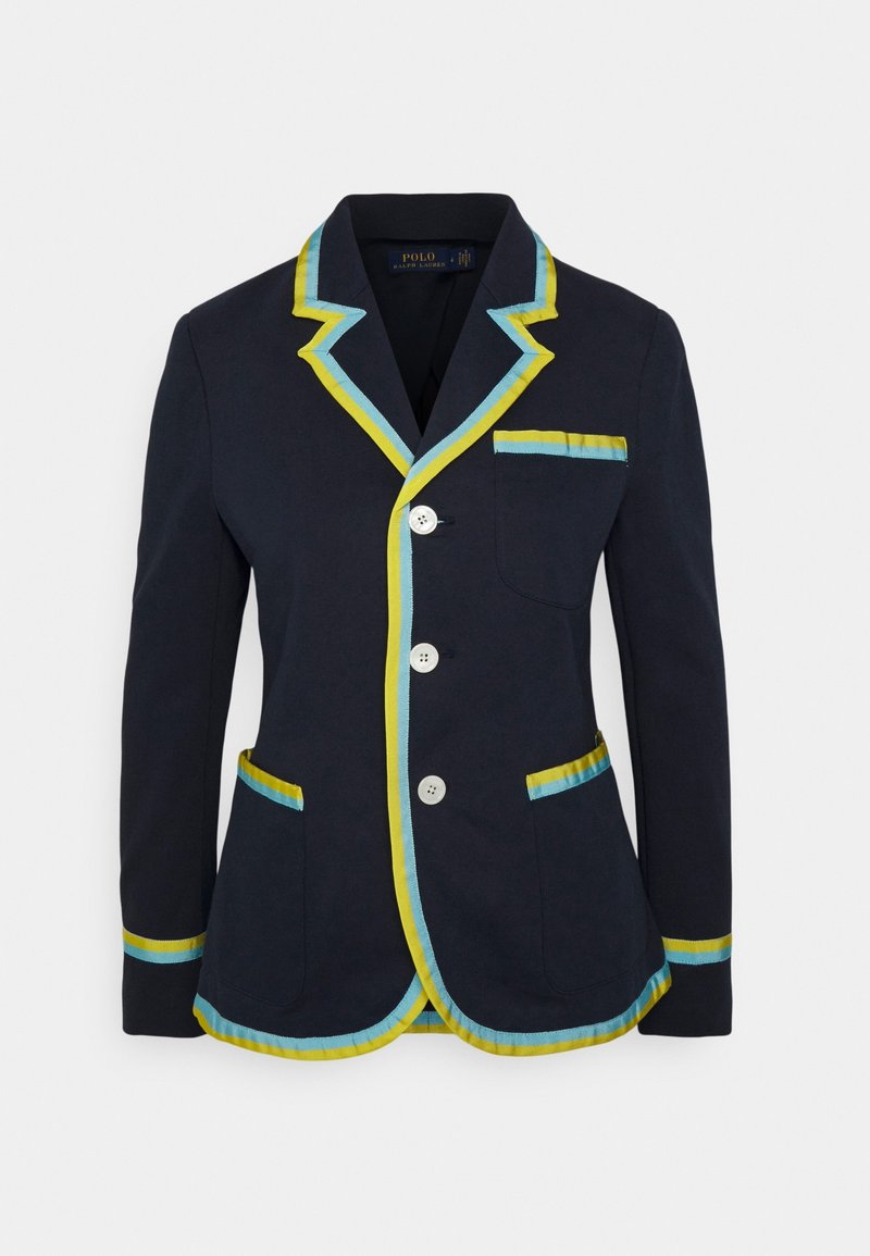 Blazer marine avec bordure jaune et bleu clair, trois boutons blancs, une poche poitrine et deux poches avant, présenté sur un fond uni.