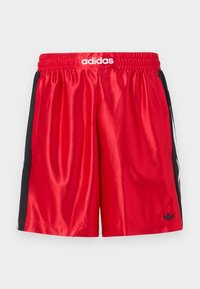Red athletic shorts with black side panels, elastic waistband, and white "adidas" logo at the front. Smooth satin texture, knee-length.