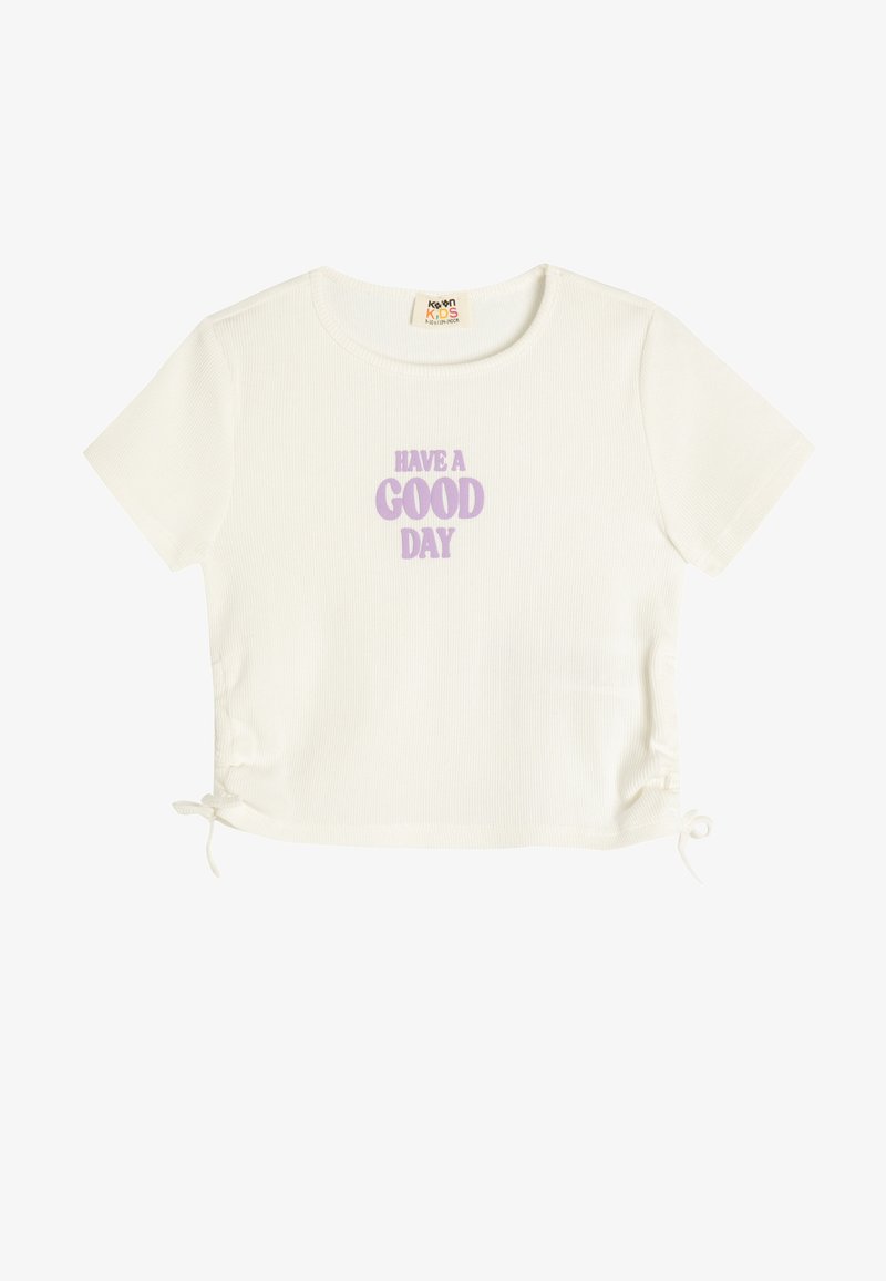 Weißes geripptes T-Shirt mit kurzen Ärmeln, auf dem "HAVE A GOOD DAY" in Lavendel gedruckt ist. Verfügt über verstellbare Seitenschlaufen für eine individuelle Anpassung.
