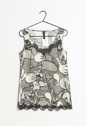 Bezrękawnik z czarno-białym wzorem lisa, zaokrąglonym dekoltem, koronkową lamówką na dole i gładką, lekką tkaniną.