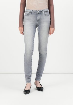 Skinny jeans in light gray denim with a faded wash; features front pockets, belt loops, and a classic five-pocket design.