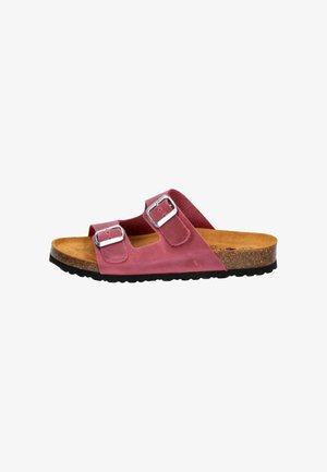 Pink suede slide sandal with two adjustable silver buckles, cork footbed, and textured black rubber sole. Open-toe design.