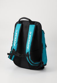 Backpack featuring durable black material with turquoise shoulder straps, mesh padding, adjustable buckles, and side pockets for storage.