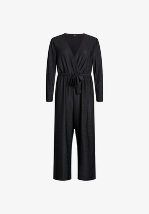 Black jumpsuit with long sleeves, V-neckline, and a tie waist. Made of a textured, shimmering fabric; wide legs extend below the ankles.