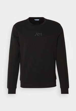 Zwarte sweatshirt van katoen, met een ronde hals, lange mouwen en een tonale logo op de borst. Zachte textuur met ribgebreide manchetten.