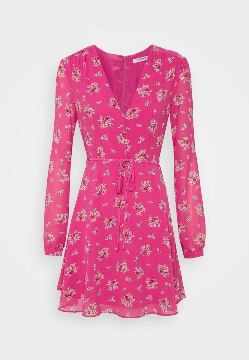 Pink long-sleeve mini dress with small floral prints, V-neck, fitted waist with tie belt, and slightly flared skirt.